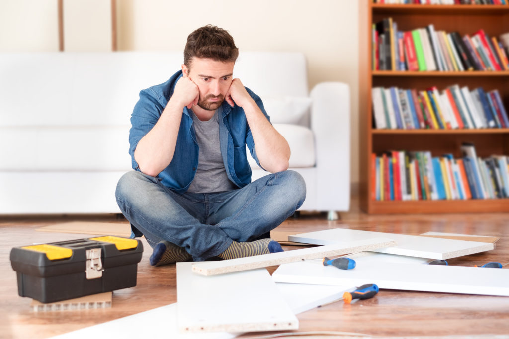 Man portrait and do it yourself furniture assembly