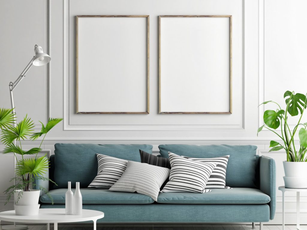 a modern living room with a beautiful couch and some accent pieces