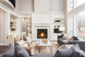 Beautiful living room interior with hardwood floors and fireplace in new luxury home