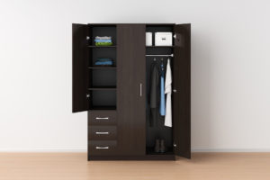 a brown armoire in an empty bedroom
