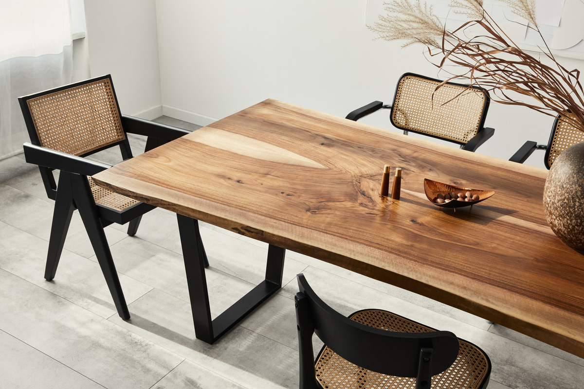 A wooden dining room table with chairs around it in El Paso.