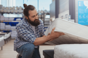 A man in a mattress store